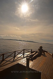 Gangga island resort boat with Bankka island in the background, Celebes sea, Pacific Ocean, Sulawesi, Indonesia, Asia